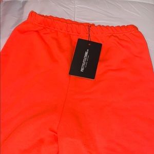 Pretty Little Thing orange joggers brand new